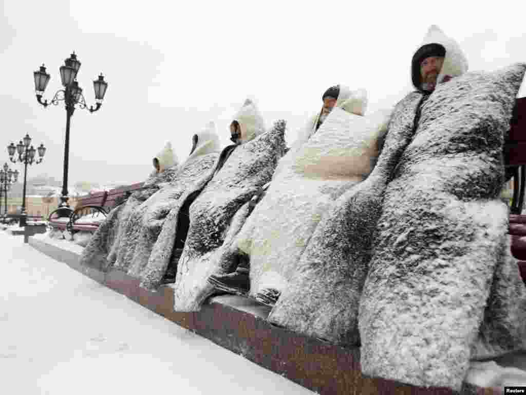 Balkar men, dressed in traditional garb, in heavy snowfall at a protest rally in Moscow, Russia. Photo by Sergei Karpukhin for Reuters