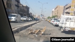 Iraq - Pothole in the street of Baghdad, undated