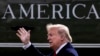 U.S. -- U.S. President Donald J. Trump waves as he walks across the South Lawn of the White House to depart by Marine One (seen behind), in Washington, DC, USA, 30 January 2020.