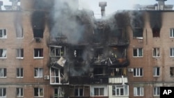  The aftermath of a Russian attack that hit a residential building in Kharkiv on June 7.