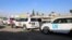 UN and International Committee of the Red Cross vehicles wait to pass through the Wafideen checkpoint on the outskirts of the capital, Damascus, on March 9.