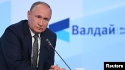 Vladimir Putin în timpul discursului de ieri de la Soci, o stațiune din Peninsula Crimeea.