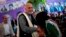 Afghan presidential candidate Ashraf Ghani Ahmadzai greets a girl at a campaign appearance in Jozjan Province on June 2. 