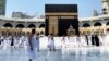 Muslims, keeping a safe social distance, perform Umrah at the Grand Mosque after Saudi authorities ease coronavirus disease (COVID-19) restrictions, in the holy city of Mecca, Saudi Arabia, October 4, 2020. REUTERS/Marwa Rashad