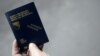 Bosnia-Herzegovina -- A man shows his new biometric passport outside a police station in central town of Zenica, 15Dec2010