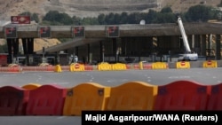 Barriers are seen at the city limits of Tehran preventing the transit of vehicles following the tightening of restrictions to curb the surge of COVID-19 on August 16.