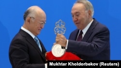 IAEA Director-General Yukiya Amano (left) and Kazakh President Nursultan Nazarbaev take part in a video link, dedicated to the opening of the Low Enriched Uranium Bank in the Kazakh city of Oskemen, in Astana on August 29. 