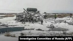 Rescuers work at the fatal crash site of a Mi-8 helicopter in Anadyr on the Chukotka Peninsula.