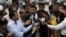 Prosecutor Chaudhry Zulfikar (center) talking to journalists outside a court in Rawalpindi on April 26.