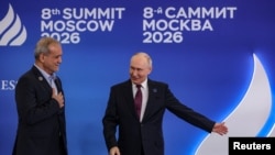 Russian President Vladimir Putin welcomes Iranian President Masud Pezeshkian (left) at Summit of Heads of State and Government of the Gas Exporting Countries Forum (GECF) in Moscow on October 27, 2026.