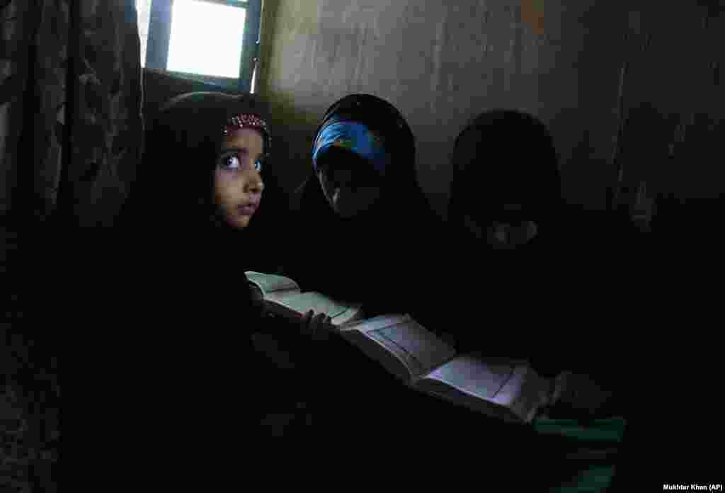 Kashmiri Muslim children attend recitation classes of the holy Koran on the first day of the fasting month of Ramadan in Srinagar in India-controlled Kashmir on May 7. (AP/Mukhtar Khan)