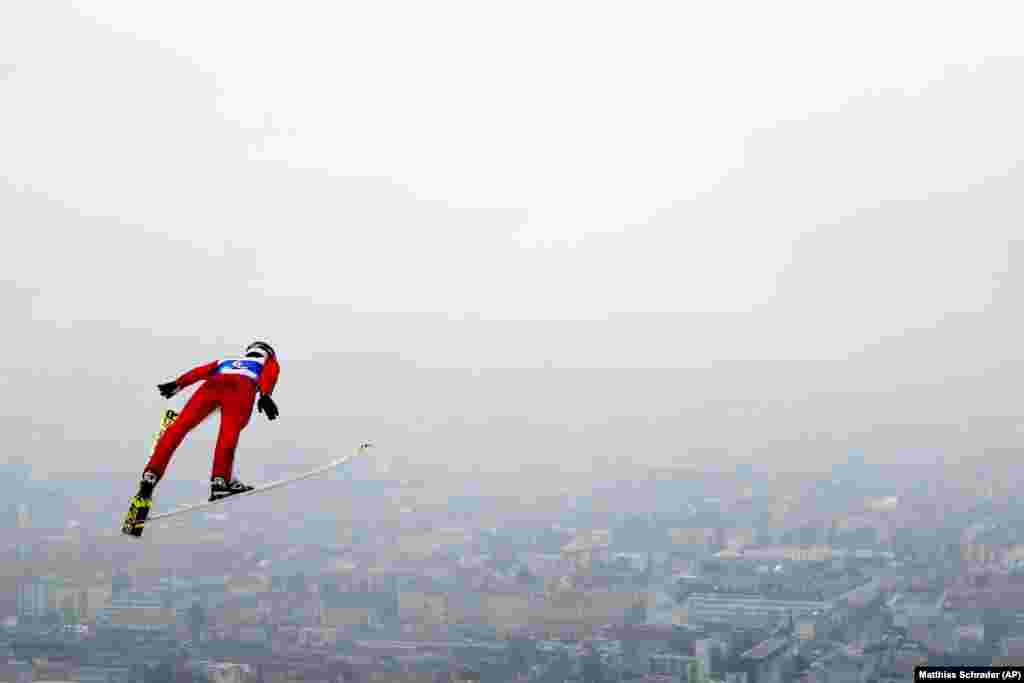 Russia&#39;s Viacheslav Barkov soars through the air during the ski-jumping portion of the Nordic Combined at the Nordic Ski World Championships in Innsbruck, Austria. (AP/Matthias Schrader)