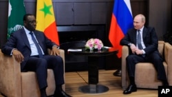 Putin's comments came after he met with Senegalese President Macky Sall (left) to discuss surging food prices.
