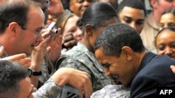 U.S. President Barack Obama greets troops during a visit to Camp Victory, just outside Baghdad, on April 7.