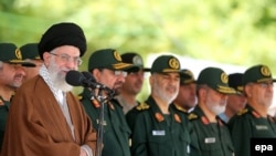 Iran's supreme leader Ayatollah Ali Khamenei (L) speaks during a visit to the Imam Hussein Military College in Tehran, May 20, 2015