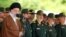 Iran's Supreme Leader Ayatollah Ali Khamenei (left) speaks during a visit to the Imam Hussein Military College in Tehran on May 20.