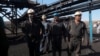 Miners gather outside after a gas explosion at a coal mine in Iran's South Khorasan Province on September 22.