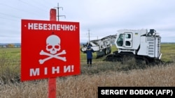Ukrainian service members use an Armtrac 400 demining machine, capable of clearing 2,400 square meters per hour, to clear a minefield in the Kharkiv region in October.