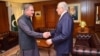 Pakistani Foreign Minister Shah Mahmood Qureshi (left) greets U.S. Special Representative for Afghanistan Zalmay Khalilzad in Islamabad on April 5. 