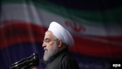 Iran -- Iranian President Hassan Rohani delivers a speech during a ceremony to mark the 38th anniversary of the Islamic revolution, on Azadi Square in Tehran, February 10, 2017