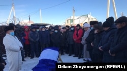 Some 200 people braved the cold weather to attend Zhanbolat Aghadil's funeral on Novermber 13. 