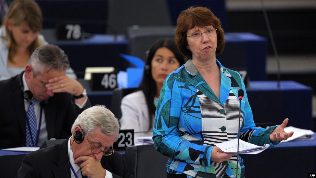European Union foreign-policy chief Catherine Ashton (right) addresses members of the European Parliament as part of a plenary session in Strasbourg on September 11.