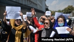 Afghan women take part in a protest march for their rights under the Taliban rule in the downtown area of Kabul on September 3. 