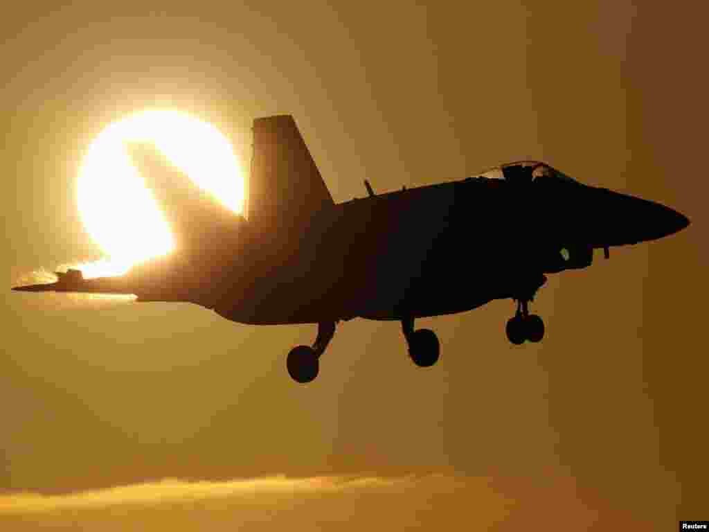 A Canadian CF-18A fighter prepares to land at the Birgi NATO air base in Trapani on the southern Italian island of SicilyPhoto by Alessandro Bianchi for Reuters