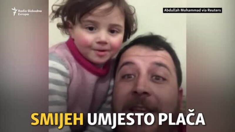 Otac tješi kćerku smijehom dok padaju bombe u Siriji