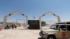 IRAQ -- A military vehicle of members of the Popular Mobilization Forces (PMF) and Iraqi Border Guards are seen on the Iraqi side of Mandali border crossing between Iraq and Iran, in Mandali, July 11, 2020