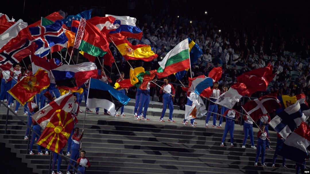 Azerbaijan -- Actors wave the national flags of during the opening ceremony of the First European Games in Baku, Azerbaijan, 12 June 2015.