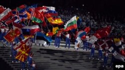 Azerbaijan -- Actors wave the national flags of during the opening ceremony of the First European Games in Baku, Azerbaijan, 12 June 2015.