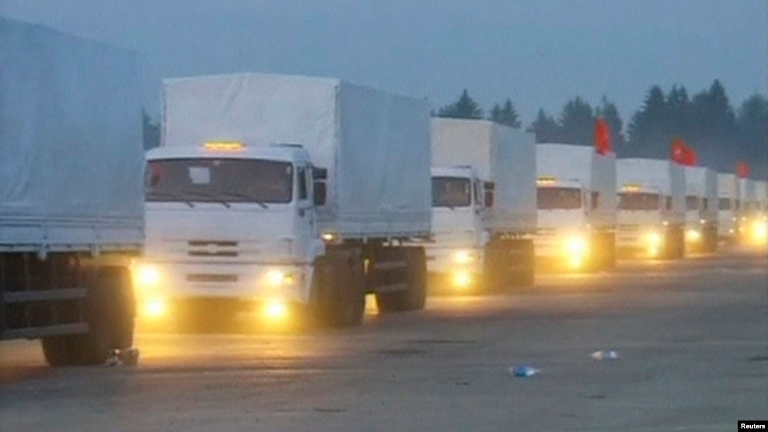 A screen capture of a Russian convoy of trucks that Moscow says is carrying humanitarian aid for Ukraine sets off from near the Russian capital on August 12.