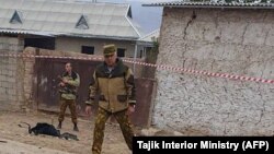 Police investigators at the border post after the attack on November 6.