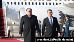 Tajik President Emomali Rahmon is welcomed by Kyrgyz President Sadyr Japarov upon his arrival in Bishkek on March 12. 