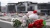 Flowers and toys are seen left at the side of a road near the burned-out Crocus City Hall concert venue in Krasnogorsk, outside Moscow, on March 26.