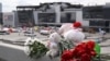 Flowers and toys are seen left at the side of a road near the burned-out Crocus City Hall concert venue in Krasnogorsk, outside Moscow, on March 26.