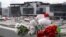 Flowers and toys are seen left at the side of a road near the burned-out Crocus City Hall concert venue in Krasnogorsk, outside Moscow, on March 26.