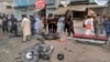 Pakistani security officials examine the site of a deadly bomb blast in Dera Ismail Khan on November 3. 