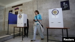 Armenia - People visit a polling station during a parliamentary election in Yerevan, June 7, 2026.