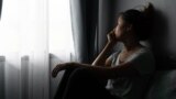 Stressed young Asian woman suffering on depression. Home domestic violence