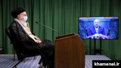 A photo showing Ali Khamenei in his COVID seclusion addressing parliament via video link. July 12, 2020