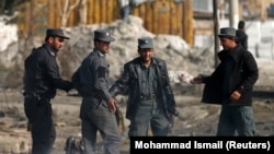 Paramilitary police from the Afghan Interior Ministry at the scene of a bomb attack in Kabul in November 2014