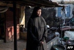 Мар’ям Сума каля свайго дому