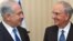 Premierul israelian Netanyahu şi emisarul american George Mitchell în cursul unei întîlniri la Londra în luna august