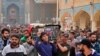 Mourners carry the coffin of Mehdi Kadim, 17, a protester killed during anti-government demonstrations, during his funeral in Najaf, Iraq, Friday, Nov. 29, 2019.(AP Photo/Anmar Khalil)