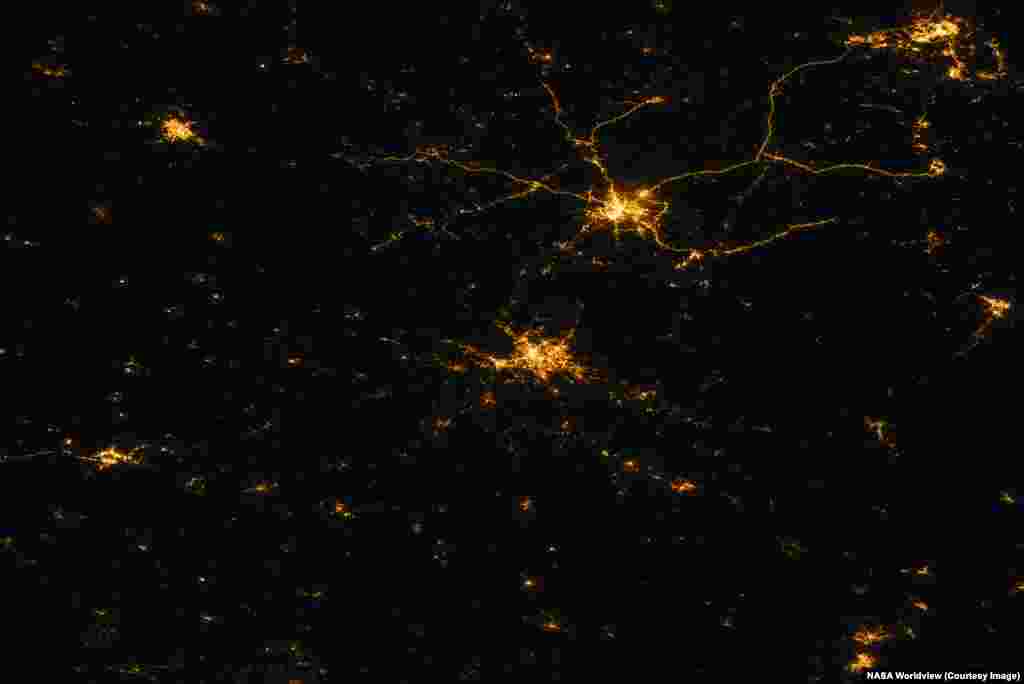 The northeastern Ukrainian city of Kharkiv (center of this image) is difficult to spot in a nighttime satellite image made on July 5, 2026. Just to the northeast, Russia's Belgorod and its well-lit highways appear largely unchanged from the historic photo, made in August 17, 2021.