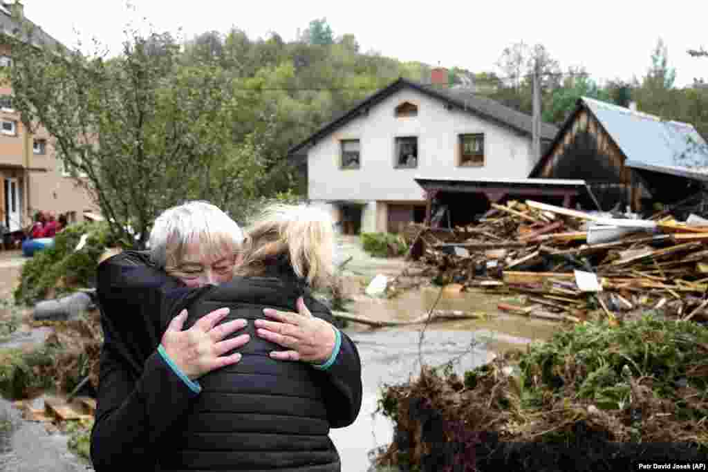 A woman embraces a relative after being evacauted from her flooded home in Jesenik, Czech Republic. &nbsp;