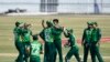 Pakistan's cricket team celebrates during the third one-day international match between Pakistan and Zimbabwe at the Rawalpindi Cricket Stadium on November 3.