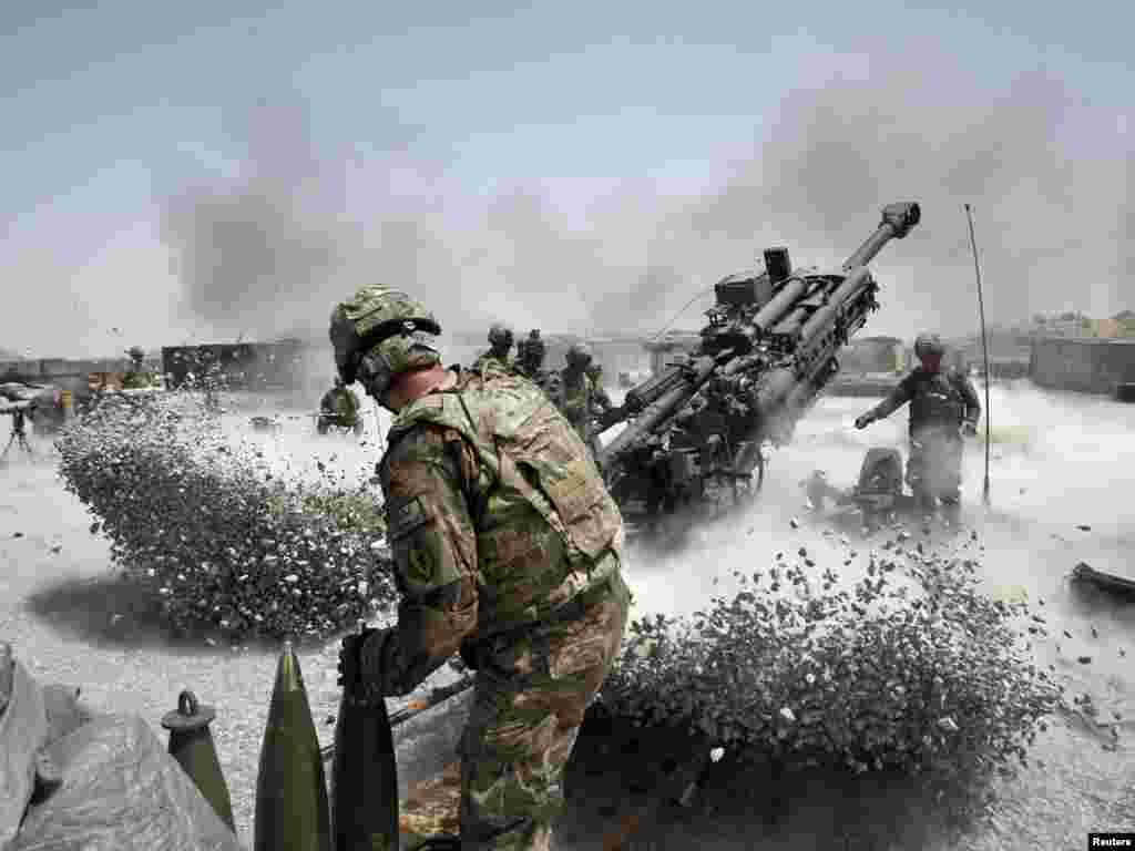 U.S. Army soldiers fire a howitzer artillery piece in Kandahar Province, southern Afghanistan, on June 12.Photo by Baz Ratner for Reuters